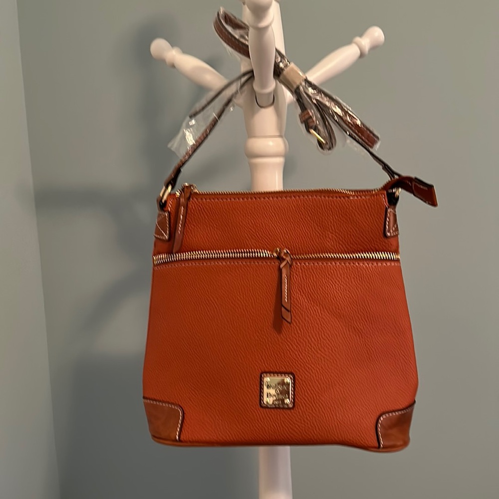 Dooney and Bourke reproduction shoulder bag, never been used